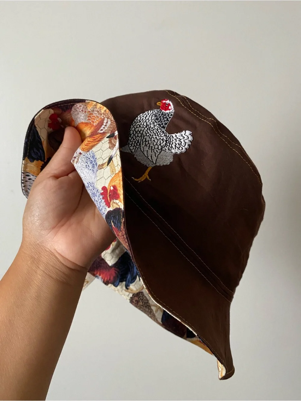 Embroidered Holland Chicken reversible bucket hat.